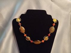 "This necklace features large tiger eye beads, gold discs, and agate beads for a bold statement piece that's perfect for autumn! Length, approx. 16.25\" excluding a 1.5\" extender." Gold Agate Beaded Necklaces With Stones, Gold Agate Beaded Necklaces, Gold Agate Round Beaded Necklaces, Gold Agate Beaded Necklace With Stones, Gold Round Agate Beaded Necklaces, Gold Agate Round Beaded Necklace, Treasure Necklace, Horse Keychain, Gold Disc