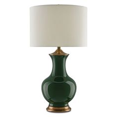 a green lamp with a white shade on it