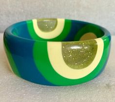 Vintage Lucite Bangle Bracelet 60 Pop Art In Greens & Cream  | eBay Retro Handmade Bangle Jewelry, Retro Green Bracelet Jewelry, Handmade Retro Bangle Bracelet, Handmade Retro Bangle For Gifts, Retro Multicolor Bangle Jewelry, Green Bangle For Collectible Jewelry, Green Bangle Collectible Jewelry, Retro Green Bangle Bracelets, Retro Green Bracelet Gift