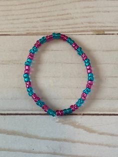 This is a seed bead bracelet. It would make a cute gift for a little girl's Birthday. They make great party favors. It has hot pink and turquoise seed beads. It was made with .8mm sturdy stretch string. I tie it several times to prevent breakage.  It fits girls ages 5-8. It stretches to fit on the wrist. All items are ready to be shipped I do combined shipping. Items ship in 2-5 business days. Check out more items at: http://www.etsy.com/shop/MesheleCrafts Culture Fair, Seed Bead Jewelery, Hot Pink And Turquoise, Girls Bracelets, Bracelets For Kids, Bracelets For Girls, Beading Jewelery, Seed Bead Bracelet, Beads Bracelet Design