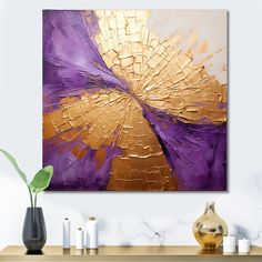 an abstract painting with gold and purple colors