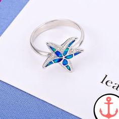 Introducing the Blue Starfish Ring: The Perfect Symbol of the Sea As passionate sea lovers, we are always on the hunt for beautiful and meaningful pieces of jewelry that reflect our deep connection to the ocean. That's why we are thrilled to present the Blue Starfish Ring—a stunning piece that captures the essence of the sea in every detail. Whether you're a seasoned sailor or simply someone who appreciates the beauty of marine life, this ring is the perfect addition to your collection. Our Star Ocean-inspired Promise Ring, Ocean-inspired Sterling Silver Starfish Jewelry, Ocean-inspired Blue Ring For Gifts, Ocean-inspired Blue Ring For Gift, Ocean-inspired Blue Rings As Gifts, Ocean-inspired Starfish Jewelry In Ocean Color, Ocean-inspired Starfish Jewelry, Silver Starfish Ring For Gift, Blue Ocean-inspired Jewelry For Anniversary