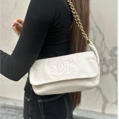 This Is An Authentic Preown Chanel Lambskin Medium Rodeo Drive Flap In Beige. This Chic Shoulder Bag Is Crafted Of Supple Lambskin With A Stitched Frontal Chanel Cc Logo. Gold Tone Hardware. The Bag Features A Unique Shoulder Strap Comprised Of Thick Looping Gold Chain Link And Beige Lambskin Wide Straps. The Flap Opens To A Luxe Satin Interior With A Zippered Pocket. This Is An Excellent Bag That Is Ideal For Day Or Evening With A Distinctive Look, From Chanel. Serial Number Present. Very Good Beige Handbag, Beige Handbags, Rodeo Drive, Cc Logo, Wide Straps, Chanel Bag, Rodeo, Chain Link, Gold Chain