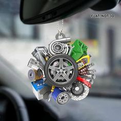 a car dashboard ornament with assorted items hanging from it