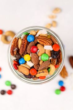 a glass jar filled with nuts and candy