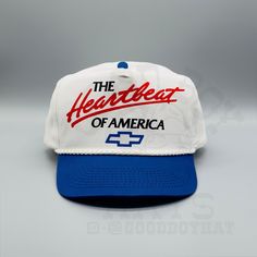 Custom made 80s/90s retro 2-tone trucker snapback hat with a The Heartbeat Of America Chevrolet ** This hat is for Medium-Semi XL heads, ranges anywhere from US hat size 7 - 7 5/8 with out using all the snaps in the closure.** "The Heartbeat Of America Chevy" * Royal Blue/White * One Size Fits Most * 5-Panel Cotton Twill, 2-Tone * High Profile, 3 ¾" Structured Crown * Cotton Twill * Half-Moon * Snapback Closure **We try to provide every angle in the pictures so please read the description carefully of product listing, size, & fit description & measurements. Also please ask any questions about sizing prior to ordering if you are concerned. Follow us on IG for new items & updates @GoodBoyHat Vintage White 5-panel Trucker Hat, Vintage Trucker Hat With Logo Patch And Curved Bill, Patriotic White Snapback Trucker Hat, Usa-made Trucker Hat With Curved Bill, Vintage Blue Trucker Hat, America Hat, White Trucker Hat, Retro 2, 90s Retro