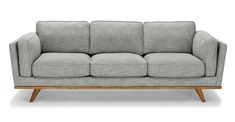 a gray couch sitting on top of a wooden frame