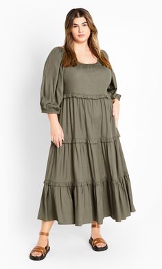 Bring your inner boho chic game, in the Heather Tier Dress. Presenting this casual relaxed fit, pull over style with a round neckline & an elongating tiered skirt, perfect for the comfort versatile styling. Key Features Include: - Round neckline - Elbow sleeves with elastic cuff - Pull over style - Tiered frilled detail - Midi hemline Pair with a denim jacket and sneakers for shopping with friends. | Plus Size Dress Heather Tier 26 in Olive, Size 16/S | City Chic Casual Tiered Maternity Dress For Spring, Bohemian Midi-length Tiered Dress For Brunch, Spring Maternity Tiered Maxi Dress, Casual Tiered Maternity Dress, Green V-neck Spring Tiered Dress, Shopping With Friends, Prairie Dresses, Tier Dress, Olive Dress