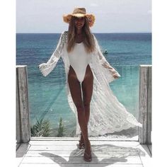 Spend sun-drenched days soaking up rays in this white lace Martina Cover up! This see-through lace kimono combines that effortless bohemian it-girl vibe with timeless sex appeal. Perfect to wear on the beach, lounging at a pool, or over jean shorts and a tank top.90% Polyester, 10% CottonHeight: 56"Shoulder Width: 22"Sleeve Length: 17"See-throughDrawstring closureOne Size Lace Cover Up Outfit, Trendy Swimsuit Coverups, Beach Cover Up Outfit, Coachella Inspired Outfits, Trendy Swimsuit, Look Kimono, White Beach Cover Up, Swimsuit Coverups, Coachella Inspiration