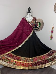 Cotton Black ChaniyaCholi / Lehenga for Garba 👗 Why Choose Our Chaniya Cholis? - Handcrafted with traditional artistry and modern flair - Perfect for Garba nights, Dandiya, and all Navratri celebrations - Available in unique designs, and comes with 7-8 meter gher / flare - Blouse: Medium with Margins DM me for more details/photos/ pricing.  ✨Let's make this Navratri unforgettable with the perfect Chaniya Choli!✨ Bollywood Style Embroidered Choli For Traditional Ceremonies, Anarkali Lehenga With Mirror Work For Traditional Ceremonies, Black Semi-stitched Traditional Wear For Ceremonial, Traditional Art Silk Choli For Transitional Season, Ceremonial Black Bollywood Style Sets, Traditional Choli With Pallu And Traditional Drape, Traditional Choli With Pallu, Traditional Choli With Dupatta In Art Silk, Traditional Art Silk Choli With Dupatta