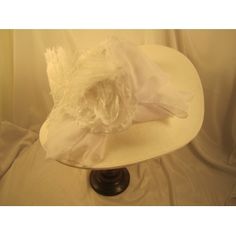 Large White Kentucky Derby Hat. Beautiful new Kentucky Derby hat.White Large Brim Derby Hat with White. This is from our new Kentucky Derby hat collection. This hat has a x-large white 7" brim, white chiffon band around the crown, white chiffon bow, big white flower, white feathers. Classic Fitted Top Hat For Wedding, Classic Mini Hats For Spring Wedding, Fitted Flat Brim Top Hat For Spring, Spring Fitted Flat Brim Top Hat, Classic Top Hat For Spring, Fitted Top Hat With Flat Brim For Garden Party, Classic White Hats For Garden Party, Classic White Hat For Garden Party, Classic Mini Hat For Formal Spring Occasions