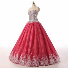 Step into a world of elegance and fantasy with this enchanting Pink Ball Gown. Expertly crafted to capture hearts, the bodice is adorned with exquisite lace and sequins, creating a dazzling effect that glistens with every movement. The back corset detailing not only adds a touch of vintage charm but also ensures a perfect fit that accentuates your natural silhouette.The voluminous skirt flows effortlessly to the floor, embellished with scrolling floral appliqués that add a layer of sophistication and grace. Its intricate pattern work dances in harmony with the rich pink hues, making it ideal for special occasions such as proms, quinceañeras, or formal soirées. The tulle layers create a dramatic, fairy-tale-like volume, allowing you to glide across any room with poise.Designed with comfort Lace Quinceanera Dress With Fitted Bodice For Gala, Red Sequined Ball Gown, Princess Style Floor-length Lace Dress, Glamorous Sequined Quinceanera Dress For Gala, Glamorous Quinceanera Dress With Sequins For Gala, Banquet Gown With Sweetheart Neckline And Lace, Glamorous Gown With Lace Bodice And Sweetheart Neckline, Banquet Gown With Sweetheart Neckline In Lace, Princess Style Gown With Lace Bodice