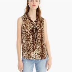 J.Crew Animal Print Blouse Size Xs/S Chest 19” Laying Flat Length 25” Front Keyhole & Attached Tie Neck Extra Button Sleeveless 100% Polyester New With Tags Msrp $59 Casual Sleeveless Leopard Print Top, Casual Leopard Print Sleeveless Tank Top, Chic Leopard Print Sleeveless Top, Leopard Print Summer Workwear Top, Summer Workwear Leopard Print Tops, Leopard Print Tops For Summer Workwear, Summer Leopard Print Tops For Workwear, Summer Leopard Print Top For Work, Animal Print Blouse