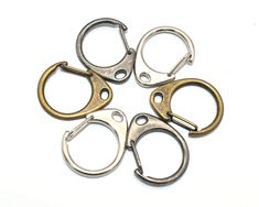 four metal handcuffs on a white background