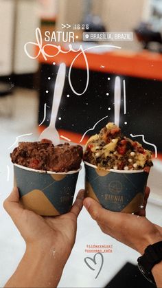 two people holding up ice cream cones with toppings