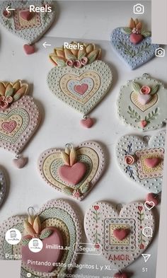 some heart shaped cookies are arranged on a white counter top with words in spanish and english