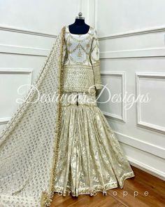 Made to Order/Measurement/Custom Order Sharara suit - Color : Ivory - Fabric : Embroidered Georgette and banarasi -  Dupatta with Gold Border - - It can be customize in any design or size and color PLEASE NOTE: BUYERS ARE RESPONSIBLE FOR ANY CUSTOMS AND IMPORT TAXES THAT MAY APPLY. This is a made to order product. If you opt for 'Made To Measurement Option', we will provide a measurement template and you can share the measurements likewise. If you want to opt for 'Standard Size', Please refer to the size chart provided in the listing. Shipping: Standard Shipping is done by DHL ecommerce and it mostly takes 2 to 3 weeks to deliver after dispatch. Express Shipping is done by DHL express and it mostly delivers within a week after dispatch. Fabric Care : Dry Clean Only PLEASE NOT THE FRINGES I Fitted Cream Palazzo Set With Dupatta, White Palazzo Set With Gota Work For Diwali, Off White Georgette Palazzo Set With Dupatta, Off White Sharara With Mirror Work In Traditional Drape, Semi-stitched Off White Palazzo Set For Festive Occasions, Off White Anarkali Georgette Palazzo Set, Cream Palazzo Set With Mirror Work For Eid, Eid Cream Palazzo Set With Mirror Work, Cream Sharara With Mirror Work For Diwali