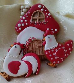 some decorated cookies sitting on top of a table