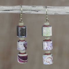 two pairs of earrings with beads hanging from them