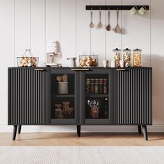 a black cabinet with food and utensils on it next to a white wall