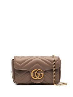 Brown leather GG Marmont super mini bag from GUCCI featuring signature Double G logo, quilted, gold-tone hardware, foldover top and chain-link shoulder strap. | Gucci GG Marmont super mini bag Gg Marmont Super Mini Bag, Gucci Marmont Super Mini, Gg Marmont Mini Bag, Gucci Super Mini, Gucci Marmont Mini, Marmont Super Mini, Gucci Marmont Bag, Double G Logo, Gg Marmont Mini