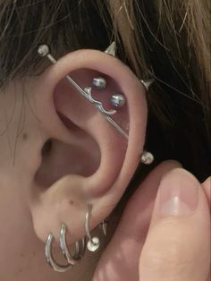 a person with ear piercings on their ears