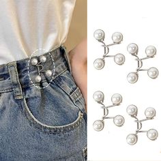 the back of a pair of jeans with pearls on them and a woman's belt