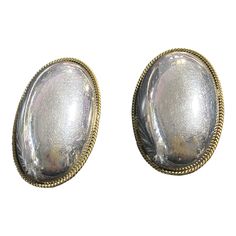 Crafted with a blend of modernist style and traditional Mexican techniques, these VTG Laton Sterling Silver Clip-On Puffy Earrings are both elegant and refined. Adorned with an Oval shape and Southwest inspiration, they are distinctly marked with "MEXICO 925" and measure 1.75 inches tall, 1 inch wide, and 0.25 inches deep. A must-have for any collection of fine jewelry. Elegant Oblong Earrings For Pierced Ears, Classic Oval Earrings For Evening, Elegant Metallic Earrings For Gift, Silver Oval Earrings For Formal Occasions, Modern Oval Earrings For Evening, Elegant Oval Cabochon Earrings For Formal Occasions, Oval Evening Earrings, Elegant Formal Oval Cabochon Earrings, Classic Oblong Earrings For Formal Occasions