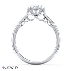 a white gold engagement ring with an intricate design