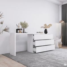 a white table with drawers and bottles on it next to a plant in a vase