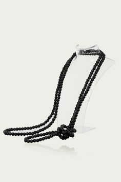 This sumptuous piece of jewelry features a retro-elegant yet slightly modern style that complements the lavish garments, reminiscent of the roaring 1920s. Features: Lustrous imitation pearls Minimalist design 69 inch / 175cm long Pearl size: 8mm in diameter Elegant Black Beaded Pearl Necklace, Elegant Long Pearl Chain Necklace For Party, Elegant Black Pearl Necklace For Evening, Elegant Party Necklace With 108 Beads, Formal Black Beaded Necklace, Elegant Necklace With 108 Beads For Party, Elegant Black Lariat Long Necklace, Classic Beaded Pearl Necklace For Evening, Elegant Wedding Necklace With 108 Beads