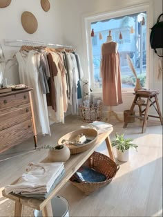 a room filled with lots of clothes and baskets