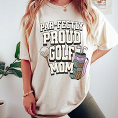 a woman wearing a tee shirt that says par - fectly proud golf mom