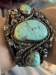 From my personal collection. It was my grandma’s whose mother spent half the year in Tucson. (My great grandma). She had a small wrist. Lovely patina. The main stone ISN’T cracked. Gorgeous turquoise and setting. Totally unique. Amazing patina. Old. I’m guessing she purchased this in the 1980s. Stones are secure and don’t move. Unsigned. This is an heirloom quality piece. Hard to find. Quick ship tracked and insured 84 grams on my kitchen scale 1.75” across at its widest 1” gap (no flex) 5,25” internal length 2” across opening Main stone is approx 1.25” long and .75” wide Vintage Turquoise Jewelry, Authentic Turquoise Jewelry, Mermaid Crafts, Great Grandma, Turquoise Bracelet Cuff, Turquoise Cuff, Kitchen Scale, My Kitchen, Bracelets And Charms