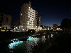 a river running through a city at night