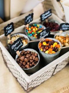 a tray filled with lots of different types of candy and candies on top of a table