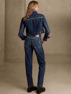 Always ready for adventure, this vintage straight jean is modeled after the classics and cut from a beautiful, dimensional denim accented with vegan leather piping at the pockets and seams.  VINTAGE STRAIGHT FIT: High-waisted and cheeky, these retro- Denim Cropped Straight Leg Jeans With Contrast Stitching, Dark Wash Cropped Jeans With Contrast Stitching, Dark Wash Cropped Denim Jeans With Contrast Stitching, Mid-rise Cropped Denim Jeans With Contrast Stitching, Fitted Jeans With Contrast Stitching For Work, Fitted Dark Wash Jeans With Contrast Stitching, Fall Dark Wash Jeans With Seam Detailing, Fall Jeans With Contrast Stitching In Denim Blue, Medium Wash Straight Leg Jeans With Contrast Stitching