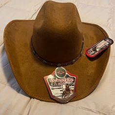 Wool And Felt Cowboy Hat, Never Worn, Camel Brown. Western Brown Hat, One Size Fits Most, Western Brown Hat One Size Fits Most, Brown Western Hat One Size Fits Most, Brown Hat For Western-themed Events, Brown Cap For Rodeo, Brown Country Style Felt Hat, Country Style Cap For Rodeo, Country Style Cap For Country Events, Brown Felt Hat For Rodeo, One Size