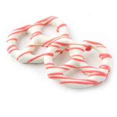 two donuts with pink and white stripes on them