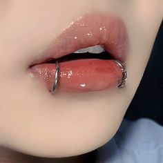 a woman's lips are covered with shiny liquid