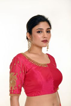 Introducing the Pink Aari Work Bridal Blouse in Pure Silk—a timeless blend of elegance and tradition. Crafted from luxurious pure silk, this stunning bridal blouse features a graceful U-neckline and elegant elbow-length sleeves. The intricate Aari work motifs delicately adorn the blouse, adding a rich and sophisticated touch to your bridal ensemble. Perfect for brides who seek a classic yet refined look, this blouse beautifully complements any saree or lehenga, making it an ideal choice for your special day. Semi-stitched Blouse With Intricate Embroidery For Wedding, Anarkali Blouse With Intricate Embroidery For Wedding, Anarkali Wedding Blouse With Intricate Embroidery, Formal Dola Silk Blouse Piece With Zari Work, Traditional Dola Silk Blouse Piece For Formal Occasion, Traditional Formal Dola Silk Blouse Piece, Formal Dola Silk Blouse Piece With Pallu, Formal Dola Silk Blouse Piece, Elegant Dola Silk Lehenga For Formal Occasions