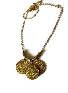 Triple Byzantine Brass Token Necklace with conical bead accents on 14K gold-filled chain.  This is a really unique and fun necklace. Bordering between chunky and simple it is easy to wear with most anything.  Please contact me with any questions. If you require specific measurements, please don't hesitate to ask.  I hope you love your item(s) as much as I loved making it. Please don't hesitate to reach out to me if you have any special requests or alterations. I am happy to make changes to piece Gold Brass Necklaces For Blessing, Gold Brass Necklace For Blessing, Gold Brass Necklace For Blessings, Nickel-free Gold Brass Charm Necklaces, Symbolic Gold Charm Necklaces Nickel Free, Bohemian Gold Nickel-free Charm Necklaces, Bohemian Gold Nickel-free Charm Necklace, Bohemian Gold Charm Necklace, Gold Amulet Charm Necklace Nickel-free