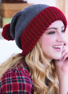 a woman wearing a red and gray hat