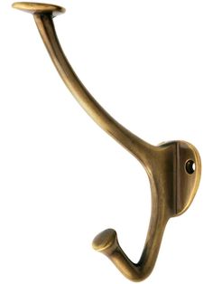 an antique brass hook on a white background