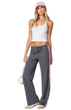 Sporty stripes trail the sides of these wide-leg cotton-blend sweatpants topped with a comfortable elasticized drawstring waist. Elastic/drawstring waist 50% cotton, 50% polyester Machine wash, dry flat Imported Athleisure Wide Leg Sweatpants With Drawstring, Wide Leg Drawstring Sweatpants In Athleisure Style, Cotton Athleisure Wide Leg Pants For Leisure, Athleisure Wide Leg Joggers With Drawstring, Sporty Cotton Wide Leg Pants, Sporty Cotton Wide Leg Pants With Ribbed Waistband, Athleisure Joggers With Side Stripes For Loungewear, Casual Cotton Bottoms With Contrast Stripes, Casual Wide Leg Pants With Striped Hem