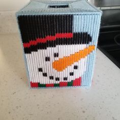 a small box made to look like a snowman