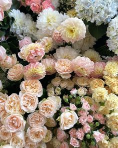 many pink and white flowers are arranged together