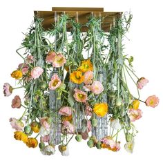 a bunch of flowers that are hanging from a light fixture