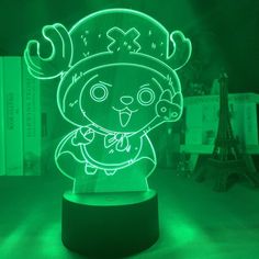 an illuminated lamp with a cartoon character in the shape of a person wearing a hat