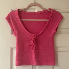 Pink Out From Under Scoop Neck Top. Stretchy And Super Cute. Lace Up And Bow In The Front. Super Stretchy. Adorable For Spring And Summer. Never Worn. No Stains Or Rips. Nwot (New Without Tags). Smoke Free Home. Feel Free To Ask Any Questions! I Am Open To All Offers. Pink Short Sleeve Cotton Knit Top, Cute Scoop Neck Top For Spring, Casual Scoop Neck Knit Top, Casual Pink Crop Top From Urban Outfitters, Urban Outfitters Pink Casual Crop Top, Trendy Cotton Knit Top With Scoop Neck, Summer Stretch T-shirt By Urban Outfitters, Urban Outfitters Casual Summer Tops, Casual Cotton Knit Top With Scoop Neck